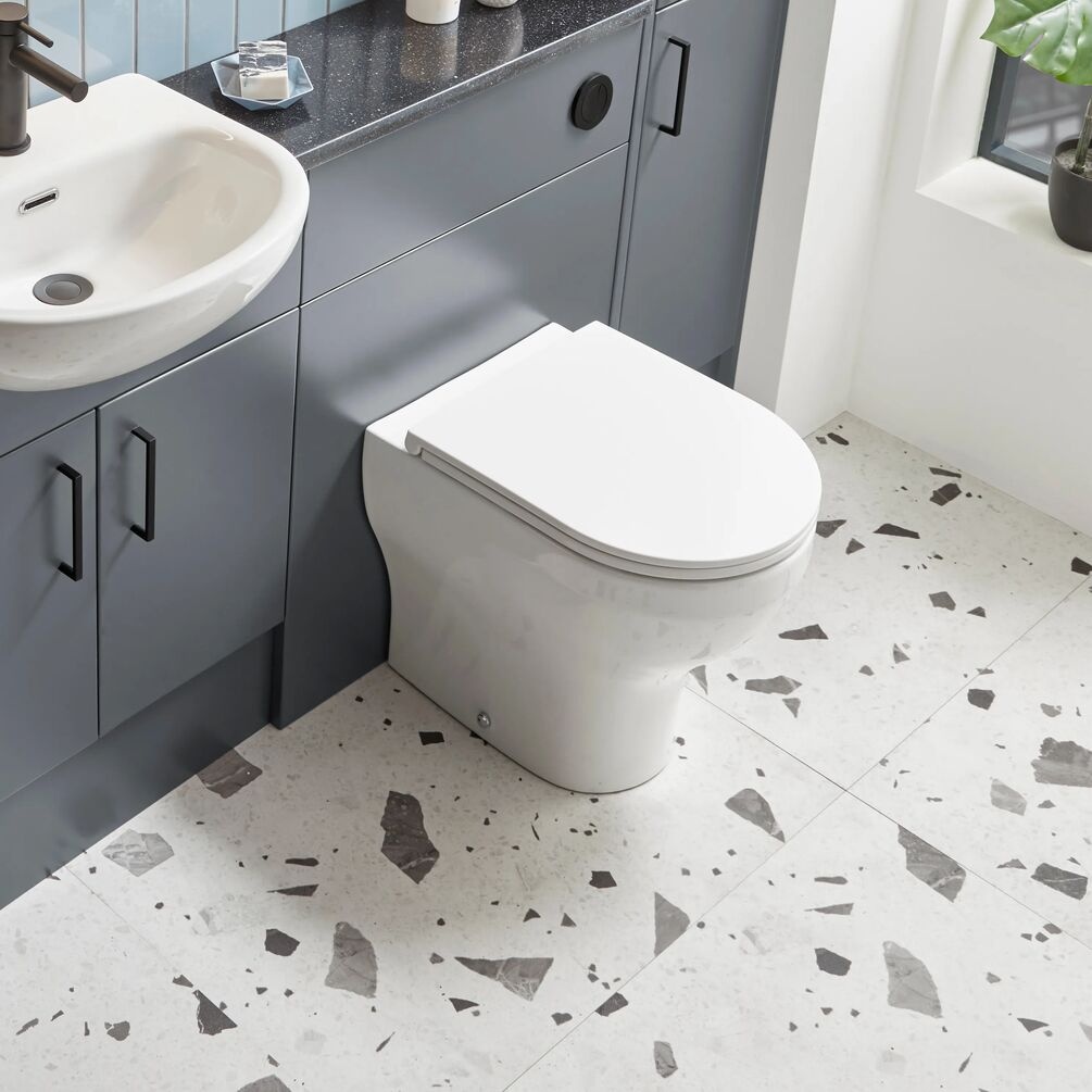 Lifestyle image of the Tavistock Micra Evo Back to Wall Toilet with Slimline Sandwich Seat